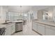 Bright kitchen with stainless steel dishwasher and a view into the dining area at 8223 Sw 113Th Ln, Ocala, FL 34481