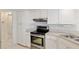 Well-lit kitchen featuring white cabinets, stainless steel appliances, and neutral countertops at 8223 Sw 113Th Ln, Ocala, FL 34481