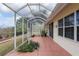 A covered patio featuring a concrete floor and view of a manicured lawn at 8223 Sw 113Th Ln, Ocala, FL 34481