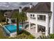 Aerial view of the home featuring a pool, balcony, and outdoor lounge area at 8482 Nw 31St Lane Rd, Ocala, FL 34482