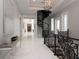 Hallway features marble floors and a dramatic staircase at 8482 Nw 31St Lane Rd, Ocala, FL 34482