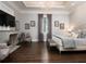 This elegant main bedroom features a fireplace, tray ceilings, and dark wood floors at 8482 Nw 31St Lane Rd, Ocala, FL 34482