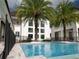 Large pool with view of the house and palm trees at 8482 Nw 31St Lane Rd, Ocala, FL 34482