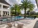 A beautiful pool featuring palm trees with lounge chairs on the deck at 8482 Nw 31St Lane Rd, Ocala, FL 34482