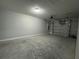 Spacious garage featuring a concrete floor and an automatic door opener at 92 Locust Loop, Ocala, FL 34472