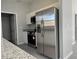 Kitchen featuring stainless steel appliances and gray countertops at 92 Locust Loop, Ocala, FL 34472