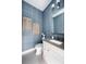 Chic powder room featuring patterned wallpaper, modern fixtures, and elegant decor at 0000 Se 47Th Loop, Ocala, FL 34480