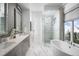 Beautiful bathroom with double vanity, soaking tub, glass shower and marble floors at 0000 Se 47Th Loop, Ocala, FL 34480
