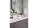 Elegant bathroom vanity featuring a quartz countertop, chrome hardware and ample storage at 0000 Se 47Th Loop, Ocala, FL 34480