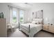 Bright bedroom with large windows, neutral decor, and comfortable furnishings at 0000 Se 47Th Loop, Ocala, FL 34480