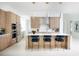 Modern kitchen boasting a large center island, stainless steel appliances, and elegant wood cabinetry at 0000 Se 47Th Loop, Ocala, FL 34480