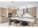 Modern kitchen boasting a large center island, stainless steel appliances, and elegant wood cabinetry at 0000 Se 47Th Loop, Ocala, FL 34480
