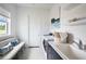 Well-lit laundry room with modern washer, dryer, sink, and ample counter space at 0000 Se 47Th Loop, Ocala, FL 34480