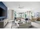 Spacious living room with modern furnishings, a large sectional sofa, and stylish decor at 0000 Se 47Th Loop, Ocala, FL 34480