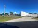 Outdoor community basketball court featuring hoops, fencing, and parking at 11001 Se Sunset Harbor Rd # A08, Summerfield, FL 34491