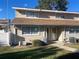 Charming two-story condo with neutral siding, manicured lawn, and pathway leading to the entrance at 11001 Se Sunset Harbor Rd # A08, Summerfield, FL 34491