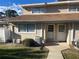 Well-maintained condo with a neat lawn, convenient walkway, and inviting facade at 11001 Se Sunset Harbor Rd # A08, Summerfield, FL 34491