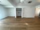 Open concept living room featuring light wood floors and large doorways at 11001 Se Sunset Harbor Rd # A08, Summerfield, FL 34491