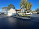 Mailboxes in a community area, with parking, landscaping, and nearby lake views at 11001 Se Sunset Harbor Rd # A08, Summerfield, FL 34491
