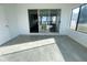 Spacious sunroom offering water views, tiled flooring, and easy access to outdoor spaces at 11001 Se Sunset Harbor Rd # A08, Summerfield, FL 34491