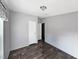 A well-lit bedroom features wood-look flooring and neutral-toned walls at 11745 Nw 15Th Lane, Ocala, FL 34482