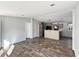 Open-concept living room featuring updated finishes, a kitchen view and light wood floor at 11745 Nw 15Th Lane, Ocala, FL 34482