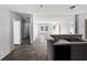 Open-concept living room featuring updated finishes, a kitchen view and a view to the front yard at 11745 Nw 15Th Lane, Ocala, FL 34482