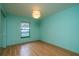 Bedroom features a light fixture, window to the exterior, and a closet with sliding mirror doors at 1255 Ne 70Th St, Ocala, FL 34479