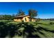 Spacious yard showcases the side view of this ranch style house at 1255 Ne 70Th St, Ocala, FL 34479
