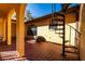 Tile patio featuring a spiral staircase and views of the surrounding greenery at 1255 Ne 70Th St, Ocala, FL 34479
