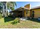 Exterior view of the enclosed porch and yard at 1255 Ne 70Th St, Ocala, FL 34479