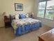 Comfortable bedroom with carpet, bright window, and coordinated decor at 12752 Se 91St Terrace Rd, Summerfield, FL 34491