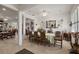 Well decorated dining room featuring an oval table, tiled floors, and bright lighting at 13424 Se 89Th Terrace Rd, Summerfield, FL 34491