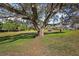 Scenic view of a lush green golf course with mature trees at 13424 Se 89Th Terrace Rd, Summerfield, FL 34491
