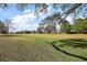 A view of a golf course with a large grass area at 13424 Se 89Th Terrace Rd, Summerfield, FL 34491