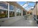 View of the spacious covered lanai featuring a screened in enclosure at 13424 Se 89Th Terrace Rd, Summerfield, FL 34491