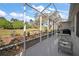 View of the spacious covered lanai overlooking the manicured yard at 13424 Se 89Th Terrace Rd, Summerfield, FL 34491