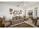 Inviting living room with patterned sofa, and area rug at 13424 Se 89Th Terrace Rd, Summerfield, FL 34491