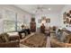 Bright living room with large window and neutral walls at 13424 Se 89Th Terrace Rd, Summerfield, FL 34491