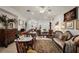 Bright living room featuring tile floors, neutral walls, and a variety of seating arrangements at 13424 Se 89Th Terrace Rd, Summerfield, FL 34491