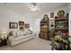 Cozy living room with bright white walls and comfortable sofa at 13424 Se 89Th Terrace Rd, Summerfield, FL 34491
