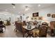 Bright living room featuring tile floors, neutral walls, and a variety of seating arrangements at 13424 Se 89Th Terrace Rd, Summerfield, FL 34491
