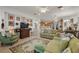 Cozy living room with fireplace and an open floor plan provides ample space for relaxing and entertaining at 13424 Se 89Th Terrace Rd, Summerfield, FL 34491
