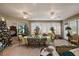 Spacious sunroom with tile floors, dining set, and views of the outdoors at 13424 Se 89Th Terrace Rd, Summerfield, FL 34491