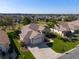 Beautiful aerial view of a single-Gathering home in a serene community with lush landscaping and well-maintained lawns at 13544 Se 89Th Terrace Rd, Summerfield, FL 34491