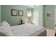 Guest bedroom with a soft green paint, standard closet, and neutral carpet at 13544 Se 89Th Terrace Rd, Summerfield, FL 34491