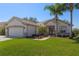 Charming single Gathering home with attached two car garage, manicured lawn, and mature landscaping at 13544 Se 89Th Terrace Rd, Summerfield, FL 34491