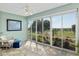 Relaxing sunroom with tile floor and sliding glass windows overlooking the golf course at 13544 Se 89Th Terrace Rd, Summerfield, FL 34491
