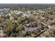 Aerial view of the residential community, showcasing mature trees and a pool area at 1621 Ne 2Nd St # 601, Ocala, FL 34470