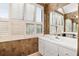 Bathroom features large shuttered windows and a spacious vanity with ample storage at 1621 Ne 2Nd St # 601, Ocala, FL 34470